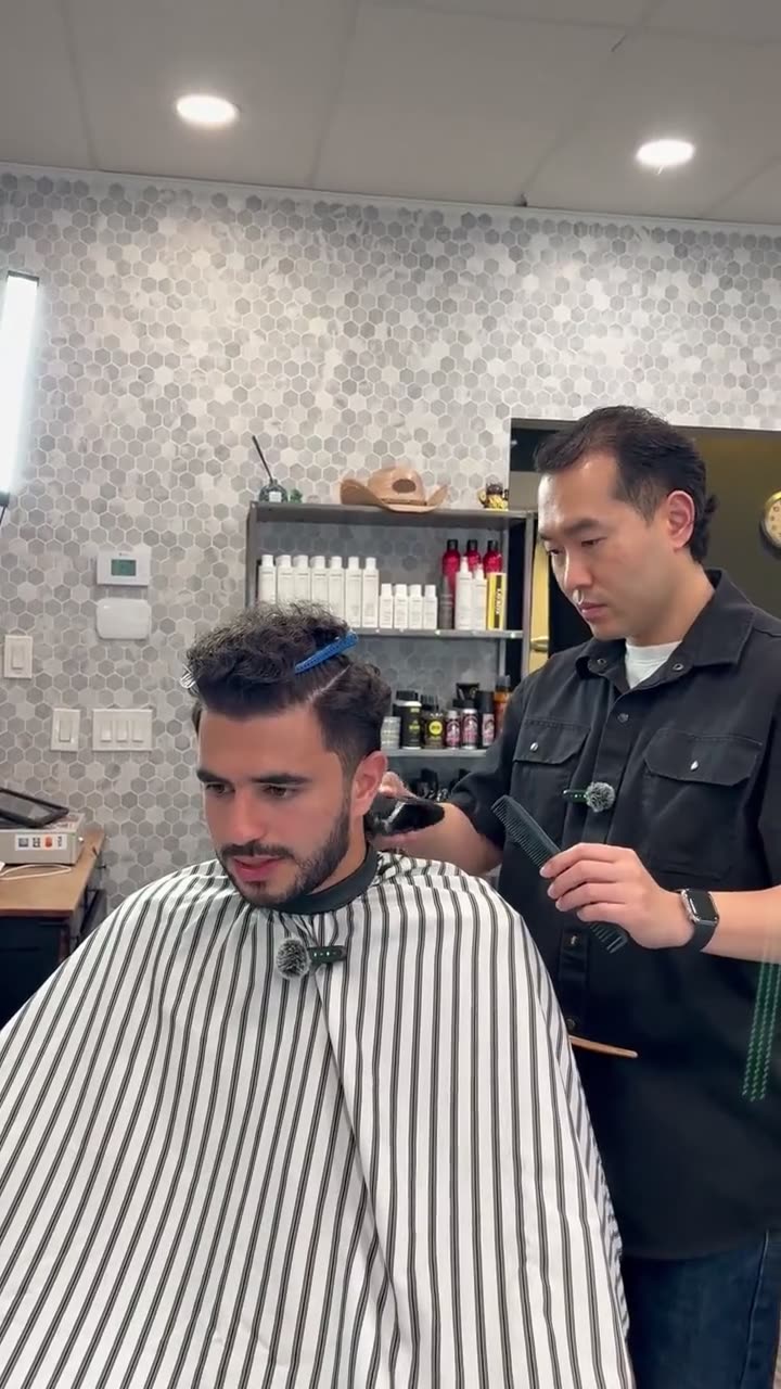 Max cutting a client's hair at Max Barber